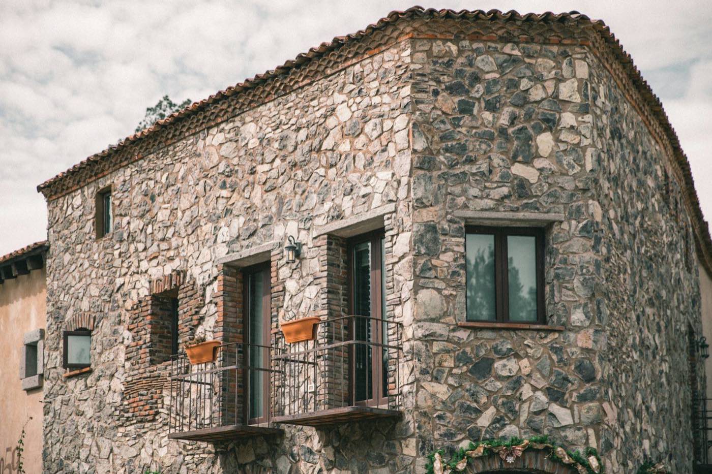 The stone facade of the finca