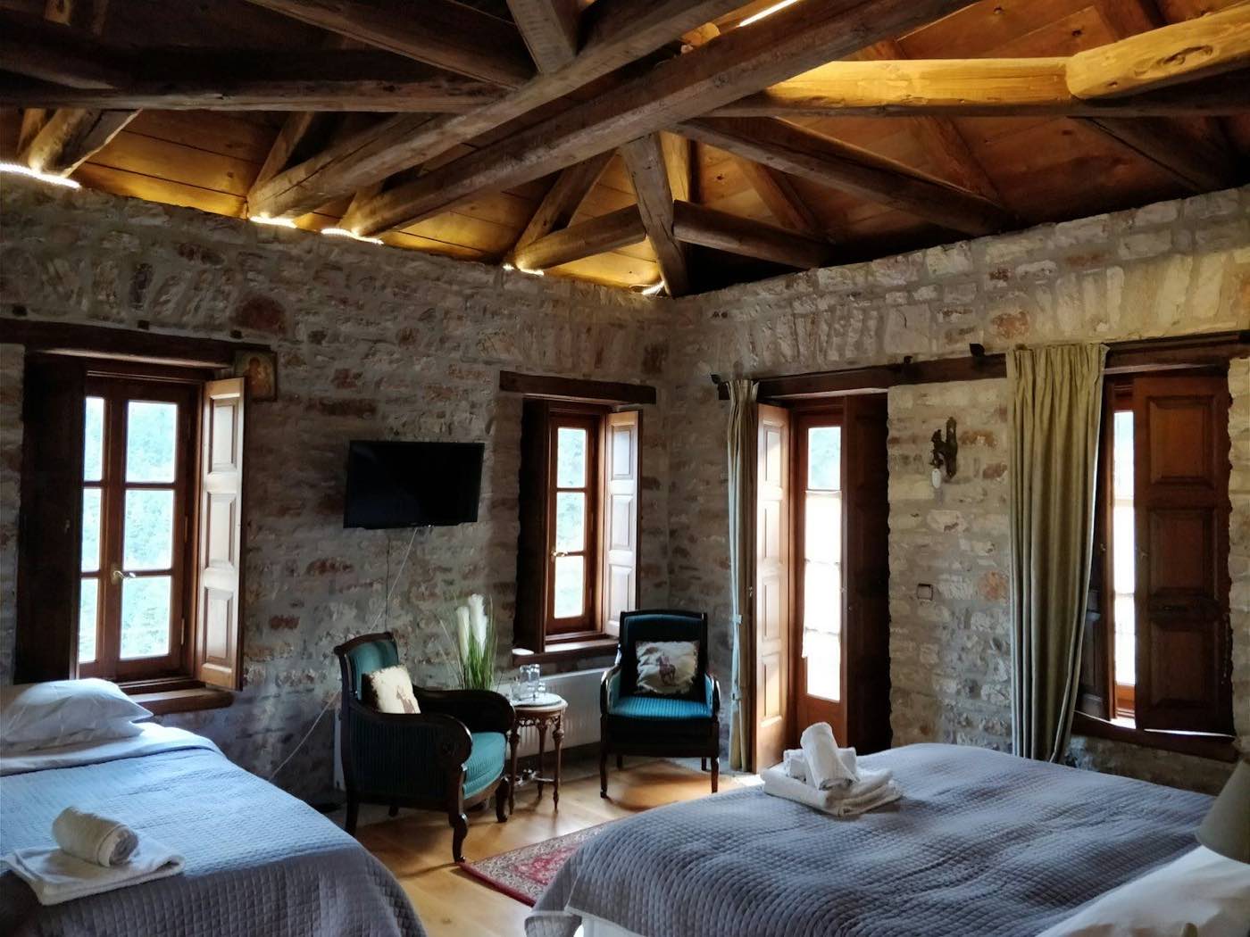 Stone bedroom with beamed ceiling